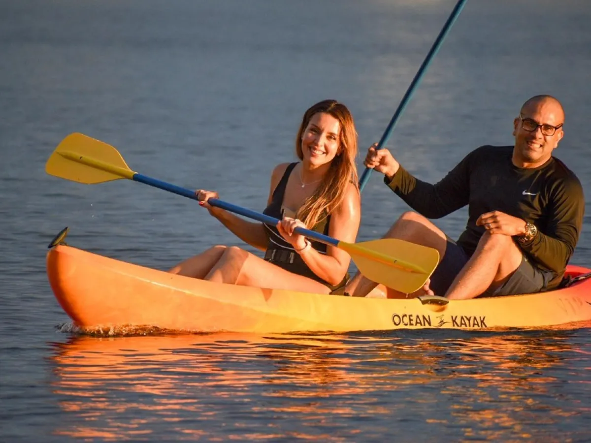 a person riding on the back of a boat in the water