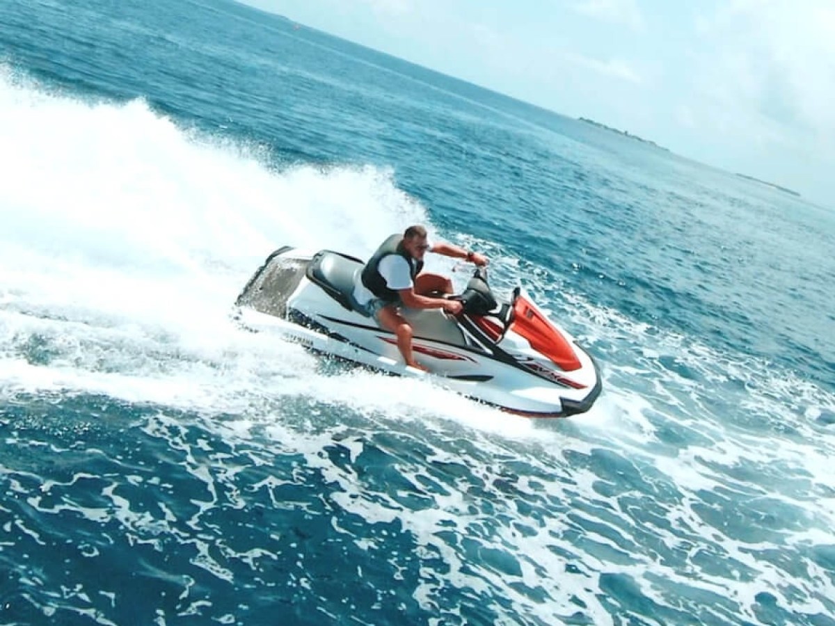a man riding a wave on a surfboard in the ocean