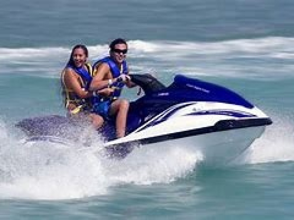 a man riding a wave on a surfboard in the water