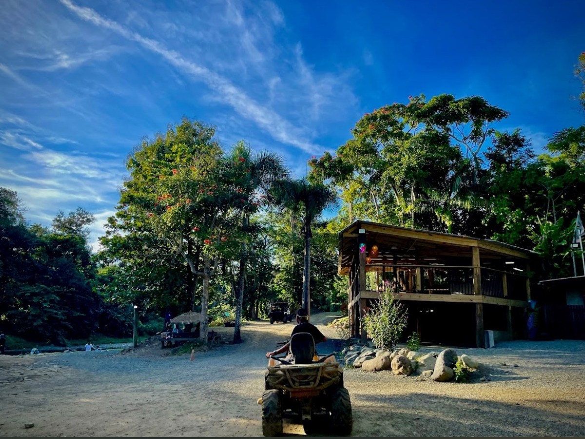 a group of people riding on the back of a motorcycle