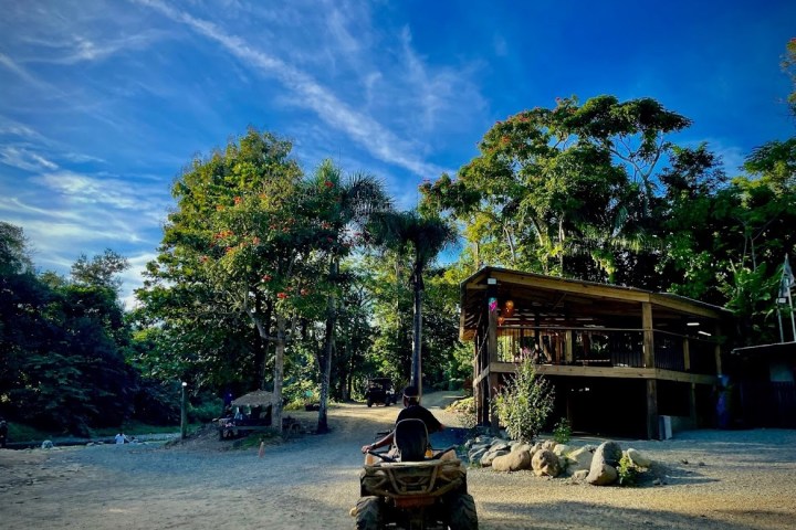 a group of people riding on the back of a motorcycle