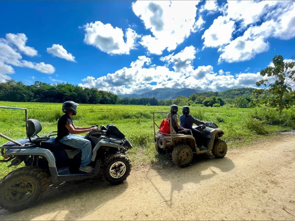 a truck parked on the side of a dirt road