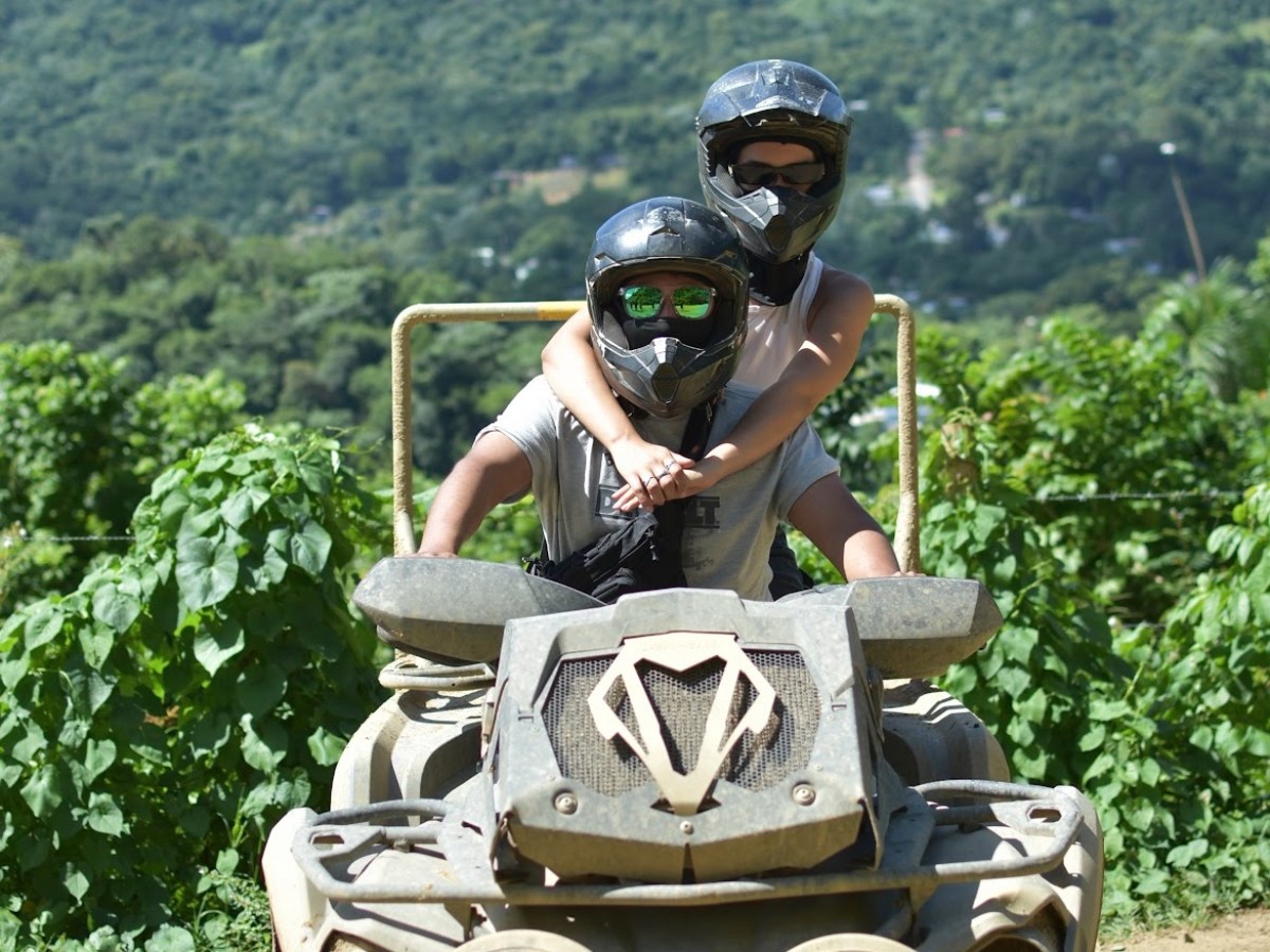 a person riding a bike down a dirt road