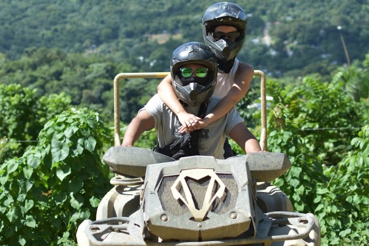a person riding a bike down a dirt road