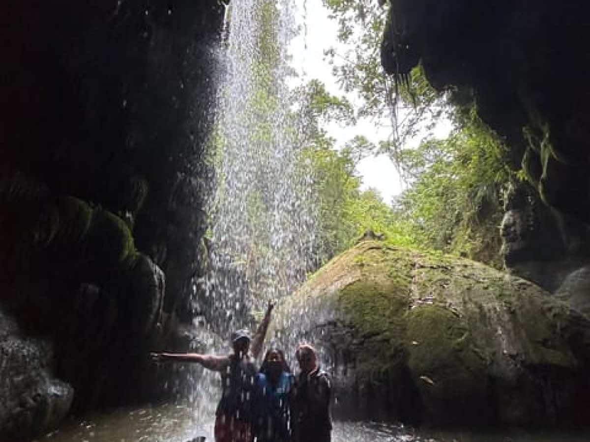 a large waterfall over a body of water