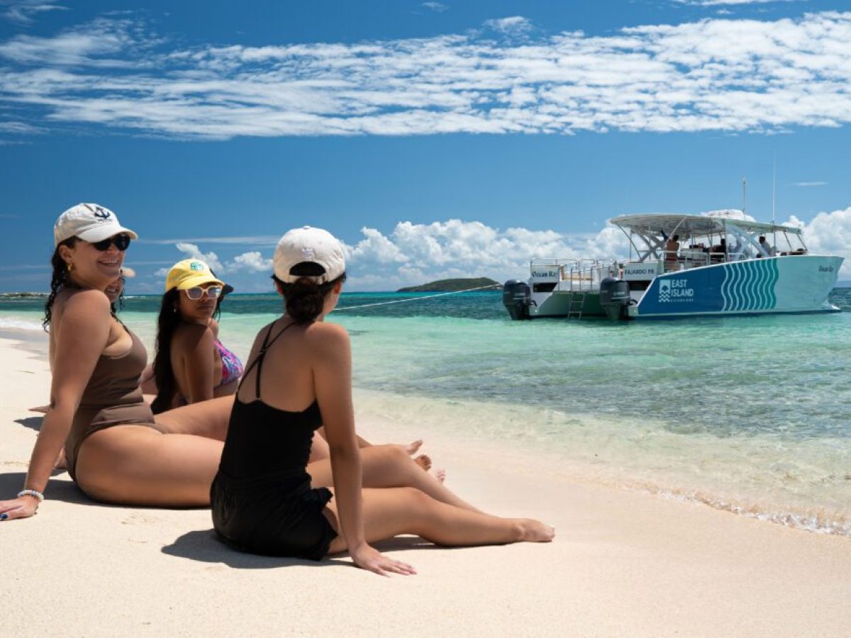 a woman sitting at a beach