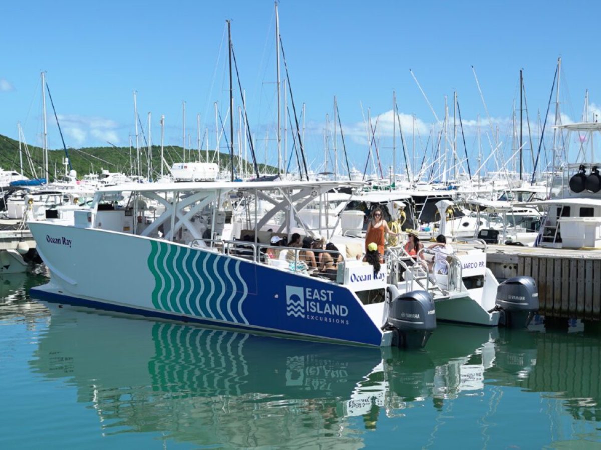a boat is docked next to a body of water