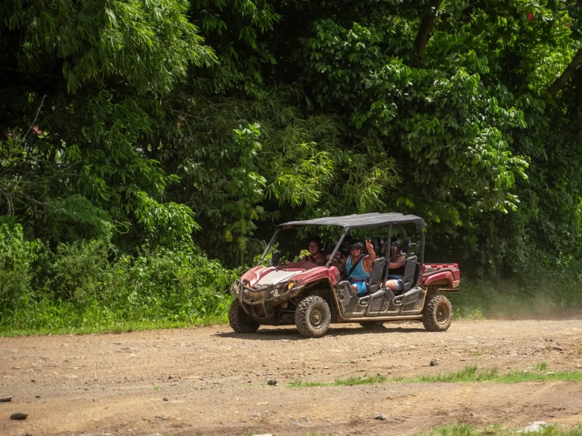 a truck driving down a dirt road
