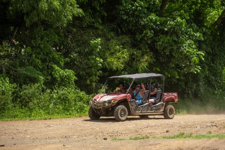 a truck driving down a dirt road