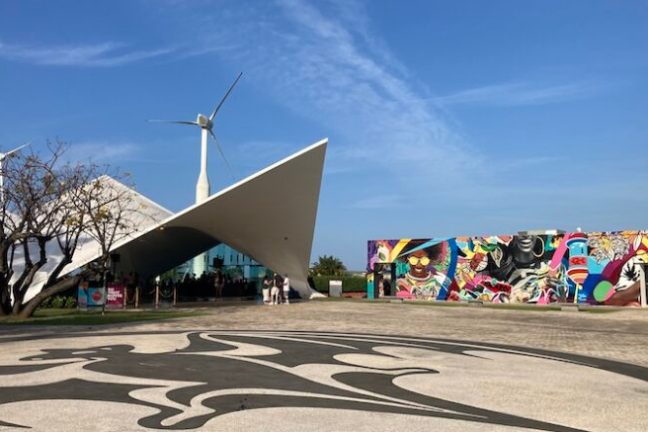 a person riding a skateboard up the side of a road